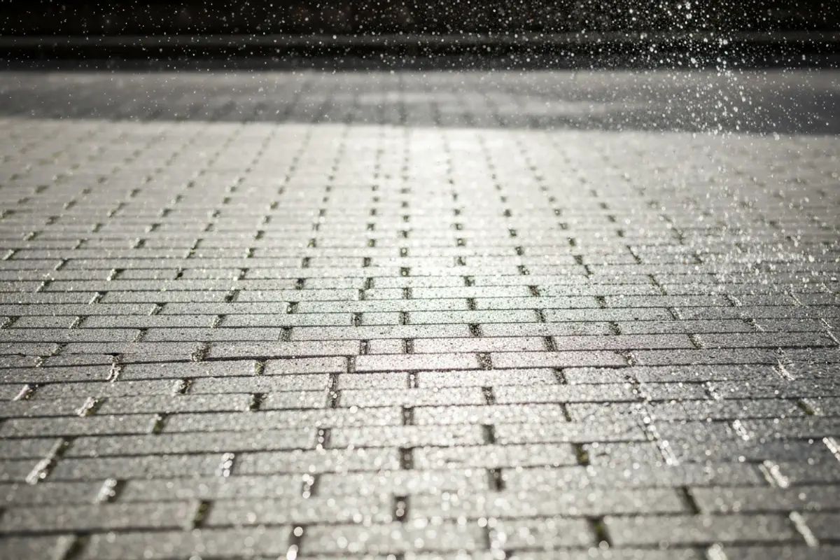 High pressure jet washing of communal block paving